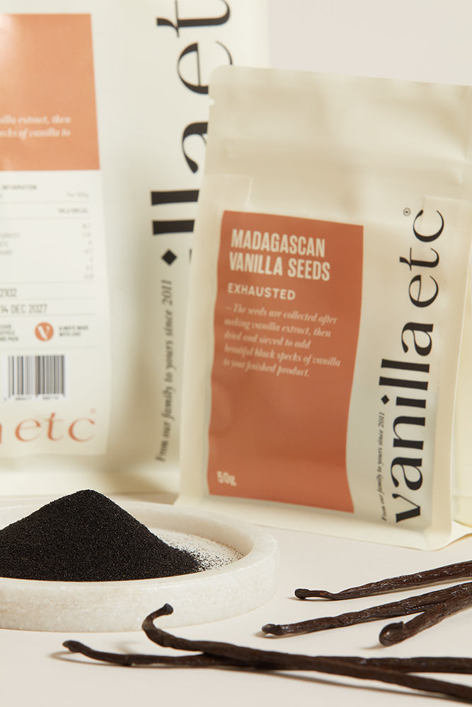 Packaging of Madagascan Vanilla Seeds with vanilla beans and powder on a light background