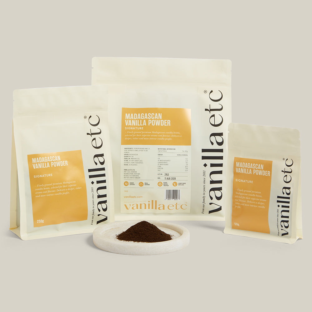 Vanilla etc packaging with vanilla powder on a light gray background