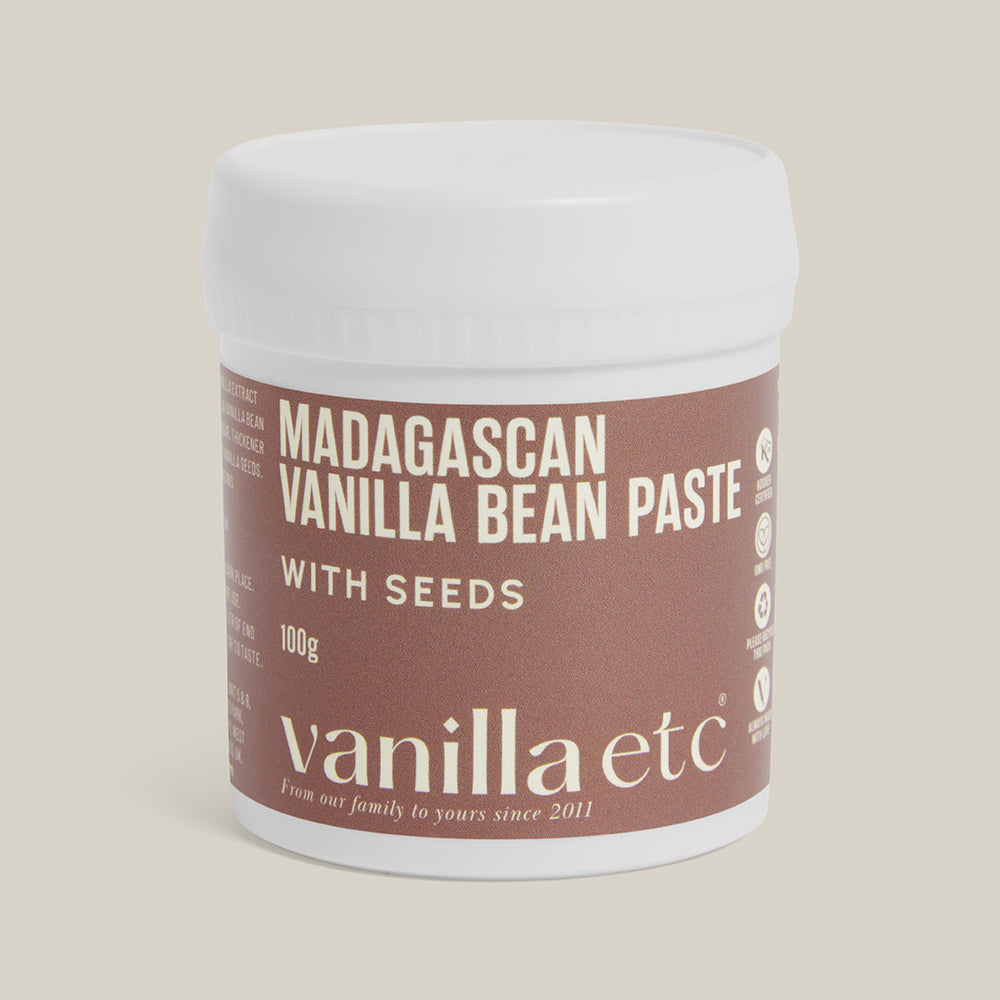 Jar of Madagascan Vanilla Bean Paste with Seeds by vanilla etc on a beige background
