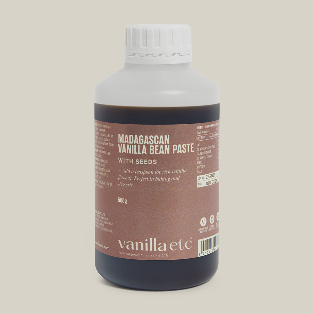 500g bottle of Madagascan Vanilla Bean Paste with Seeds on a cream background