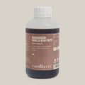 500g bottle of Madagascan Vanilla Bean Paste with Seeds on a cream background