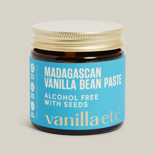 Jar of Madagascan Vanilla Bean Paste with blue label on beige background