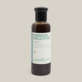 Bottle of Madagascan Vanilla Extract with a visible brand label on a cream background