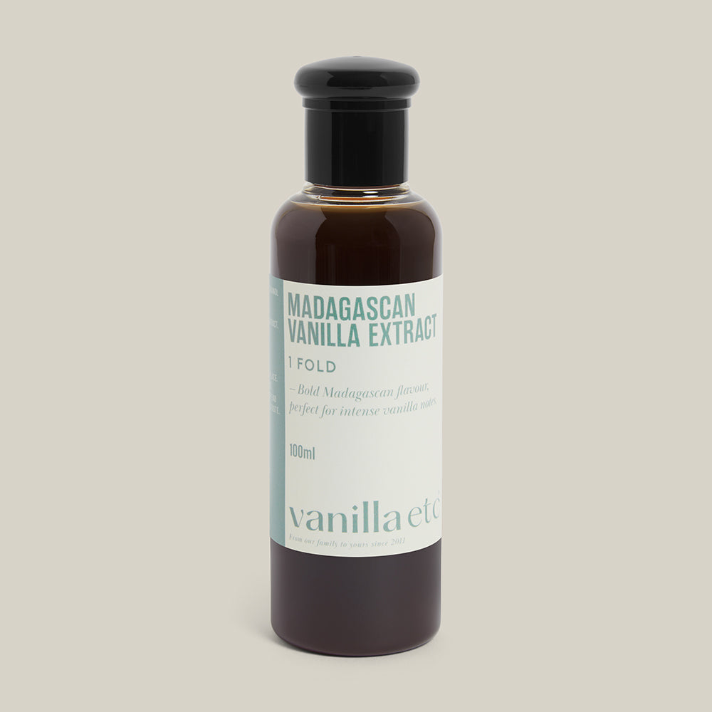 Bottle of Madagascan Vanilla Extract with a visible brand label on a cream background