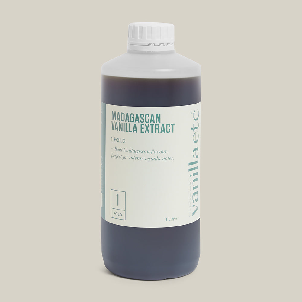 1 litre bottle of Madagascan vanilla extract on a cream background