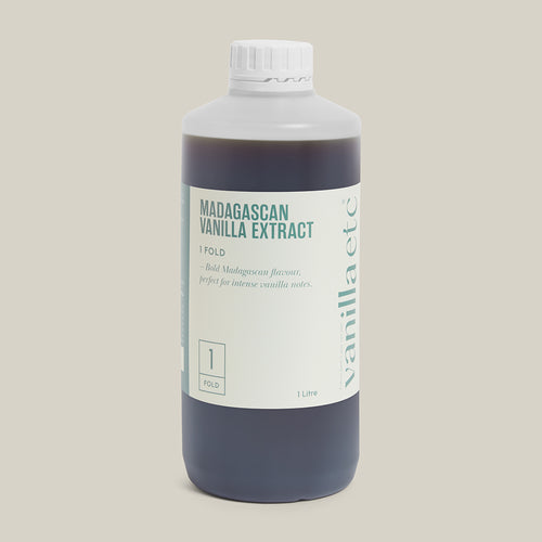 1 litre bottle of Madagascan vanilla extract on a cream background