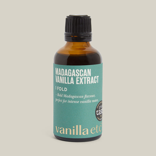 Bottle of 1 Fold Madagascan Vanilla Extract with a green label on a cream background