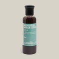 Bottle of Madagascan Vanilla Extract with a visible label on a beige background