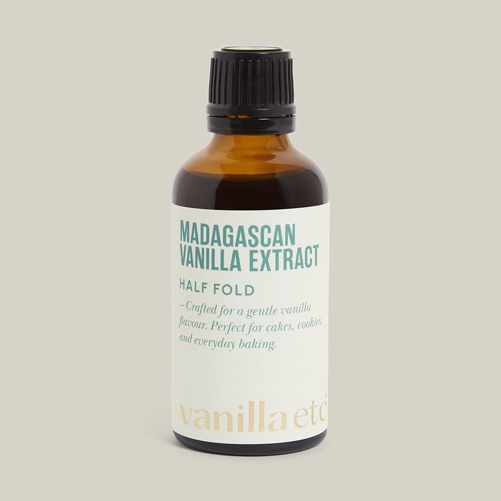 Bottle of Madagascan Vanilla Extract with a white label on a beige background