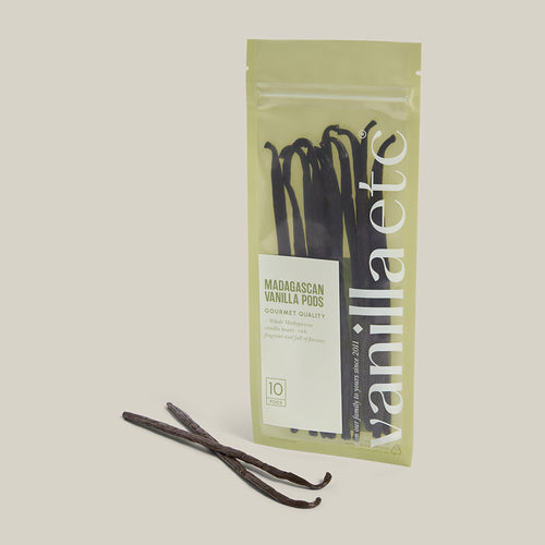 Vanilla pods in packaging on a light background