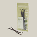 Packaging of vanilla pods with visible brand name on a light background